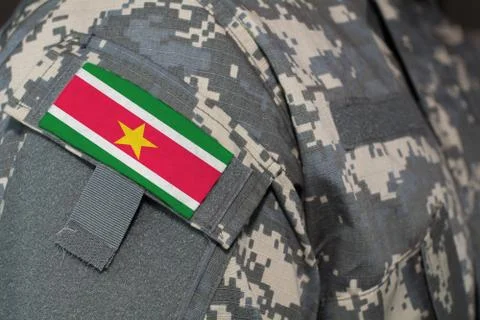 Surinam army uniform patch flag on soldiers arm. Military Concept Stock Photos