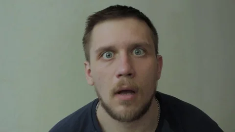 Surpising man looking at the camera. Stock-Footage 77413567