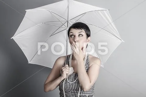 Surprise, pin up lady with umbrella, retro and vintage image Stock-Fotos