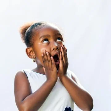 Surprised african girl with hands on face. Stock Photos
