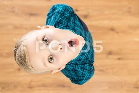 The surprised boy look to the camera. View from above Stock Photos