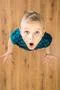 The surprised boy look to the camera. View from above Photo