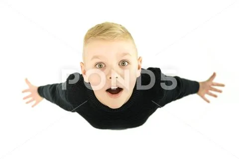 The surprised boy look to the camera. View from above Stock Photos