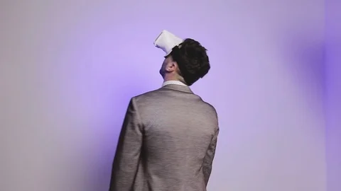 A surprised businessman uses virtual reality glasses. Stock Footage 75556989