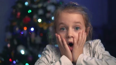 Surprised child against the background of blurry lights Stock Footage 145535682