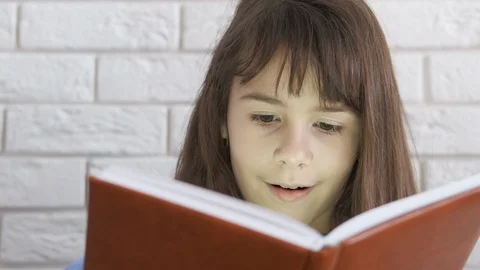 Surprised child with a book. Stock Footage 103271523