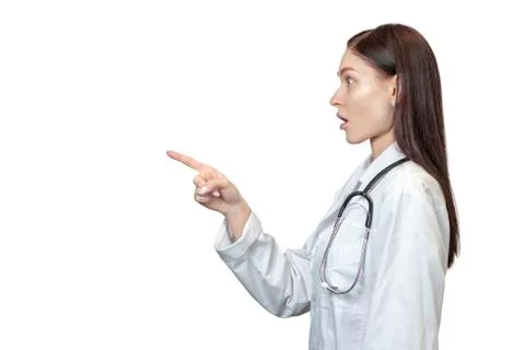 Surprised doctor points to the side Stock Photos