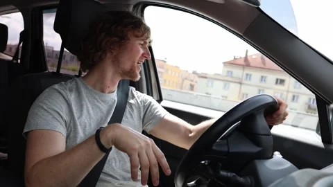 Surprised driver looks at a road accident while passing the crash scene Video stock 343720271