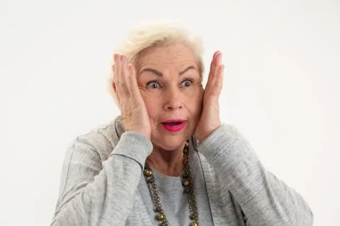 Surprised elderly female isolated. Stock Photos