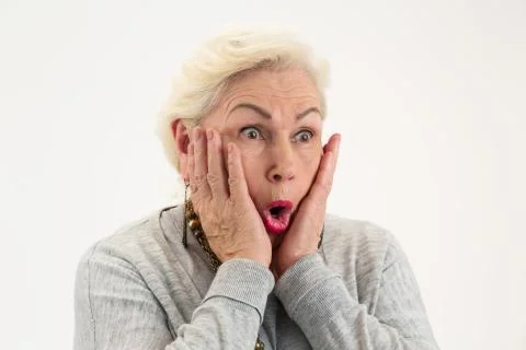 Surprised elderly lady isolated. Stock Photos