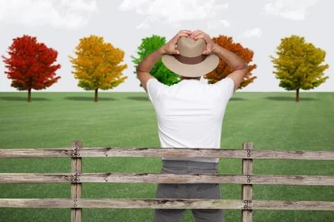Surprised farmer looking at trees Stock Photos