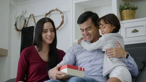 Surprised Father receiving gift box from daughter Video stock 80621795