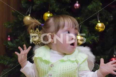 Surprised girl. Child Mimicry. Girl throws up his hands. One yea Stock Photos