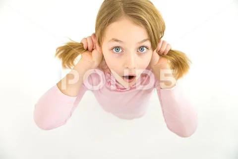 The surprised girl look to the camera. View from above Stock Photos