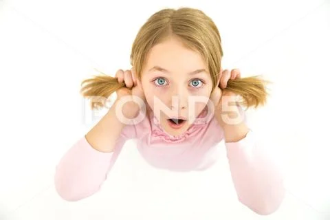 The surprised girl look to the camera. View from above Stock Photos