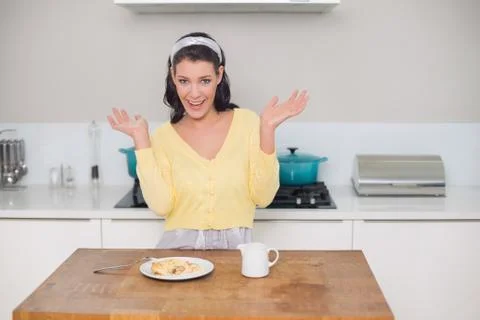 Surprised gorgeous model having dessert posing Stock Photos
