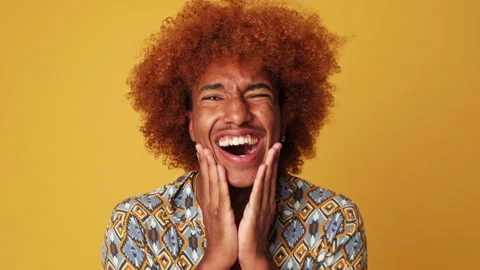 Surprised guy clapping his hands, isolated on yellow background in studio Stock Footage 287875546