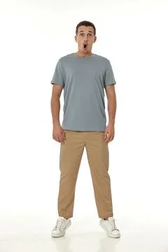 Surprised guy looking at camera on white background 写真素材