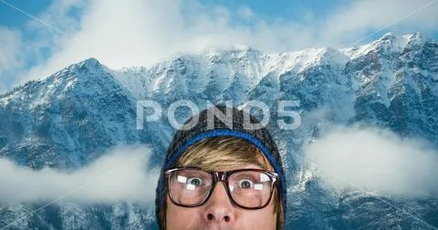 Surprised Hipster Against Snow Covered Mountains