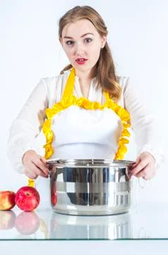 Surprised homemaker in kitchen Stock Photos