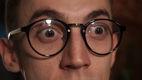The surprised look of a young man. Banknotes are flying in the face. Stock Footage 108466734