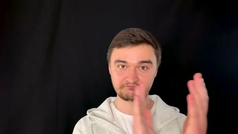 Surprised man eagerly nodding and clapping while gladly staring into the camera 스톡 동영상 192059888