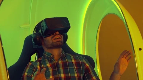 Surprised man experiencing virtual reality for the first time Stock Footage