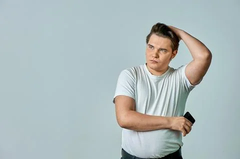 Surprised man on a gray background Stock Photos