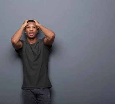Surprised man with hands on head Stock Photos