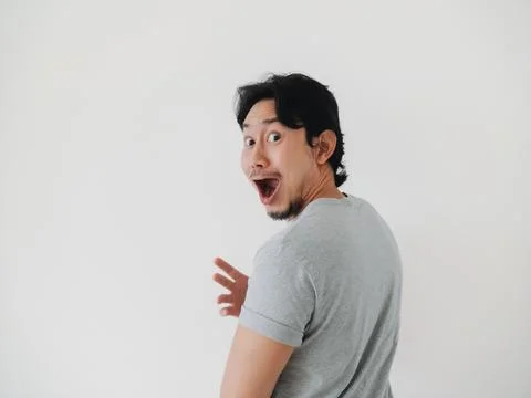 A Surprised Man Looking Back with Excitement and Enthusiasm in a Candid Out.. 스톡 사진