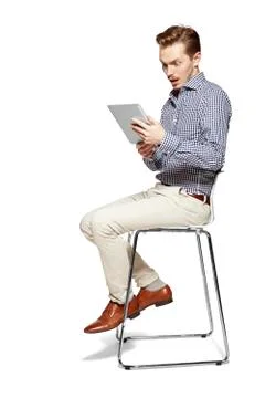 Surprised man looking at tablet Stock Photos