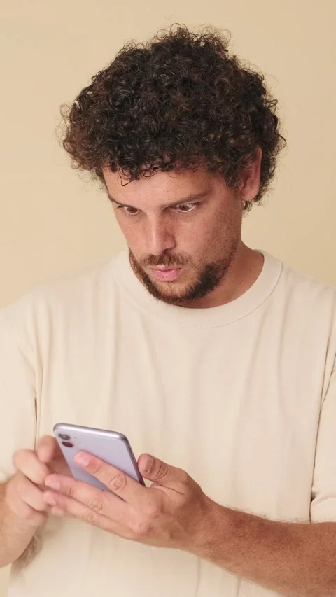 Surprised man with mobile phone in his h... | Stock Video | Pond5