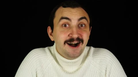 Surprised man with mustache amazement at camera over black background Stock Footage 144484499