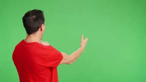 Surprised man pointing and gesturing on green screen background Stock Footage 308278475