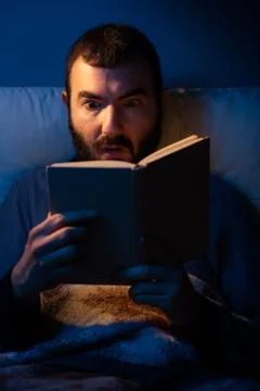 Surprised Man Reading a Book Stock Photos