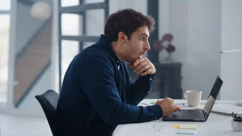 Surprised man reading documents on computer. Business man thinking on results Stock Footage 126181205