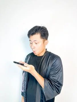 Surprised Man Receiving a Voice Message Stock Photos