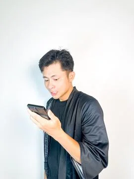 Surprised Man Receiving a Voice Message Stock Photos