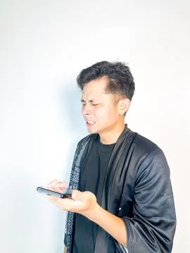 Surprised Man Receiving a Voice Message Stock Photos