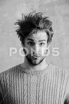 Surprised man with stylish haircut and beard Stock Photos