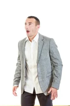 Surprised man in suit posing and looking up Stock Photos