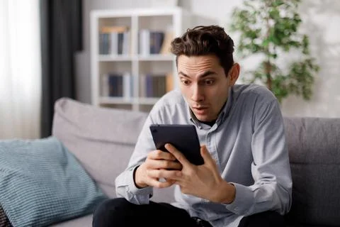 Surprised man with tablet Stock Photos