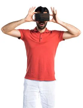 Surprised man using VR glasses Foto stock