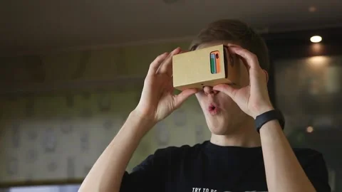 Surprised man in Virtual Reality Glasses. VR. Concent of Virtual Reality gaming Stock Footage 148188814