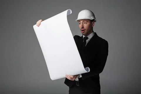 Surprised man watching at plan Stock Photos