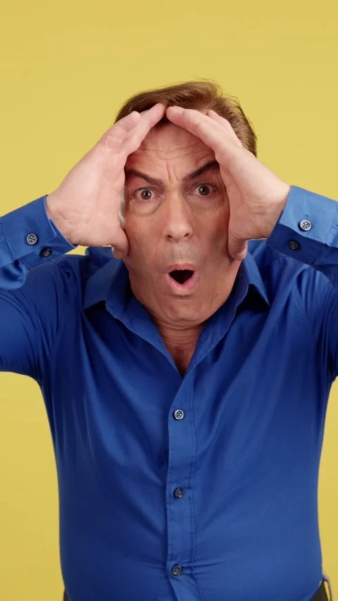 Surprised mature man gesturing that he make a mistake Video stock 239906963