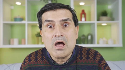 Surprised mature man looking at camera in amazement. Video stock 234110009