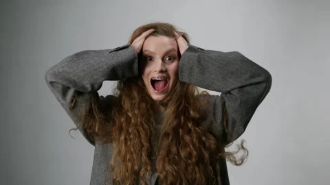 Surprised model with braces on her teeth looks at camera.Concept of even teeth Stock Footage 267824444