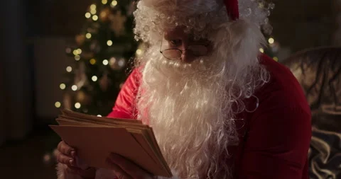 Surprised Santa Claus checking letters Video stock 167975213