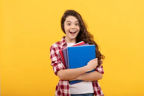 Surprised school kid ready to study with workbook, back to school Stock Photos